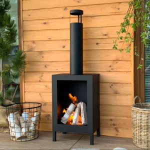 A stylish patio with a free-standing Kozen bioethanol fire in matt black