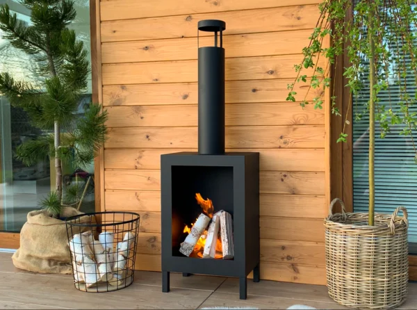 A stylish patio with a free-standing Kozen bioethanol fire in matt black