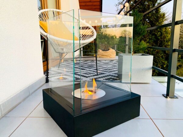 A stylish balcony with outdoor furniture and a Sunset Garden bioethanol fire